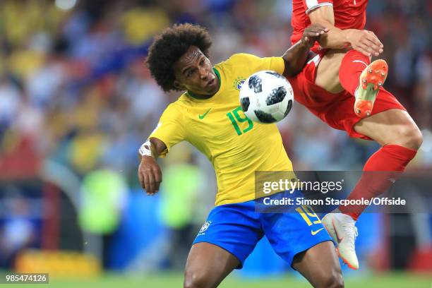 Willian of Brazil comes close to the boots of Filip Kostic of Serbia during the 2018 FIFA World Cup Russia Group E match between Serbia and Brazil at...