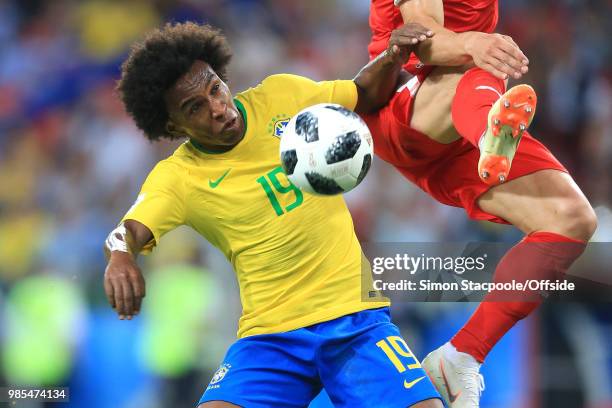 Willian of Brazil comes close to the boots of Filip Kostic of Serbia during the 2018 FIFA World Cup Russia Group E match between Serbia and Brazil at...