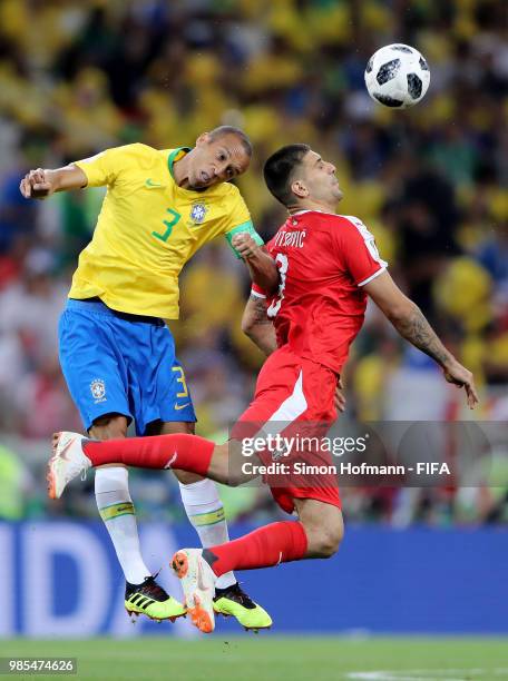 Miranda of Brazil wins a header over Aleksandar Mitrovic of Serbia during the 2018 FIFA World Cup Russia group E match between Serbia and Brazil at...