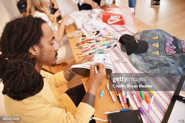 Chris Pyrate and Jordana Schrager customize DSW shoes at DSW Block Party hosted by Olympians Adam Rippon and Mirai Nagasu on June 27, 2018 at...