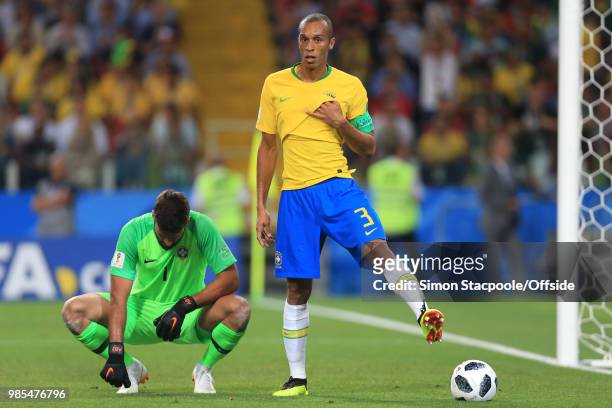 Brazil goalkeeper Alisson Becker takes a rest as Miranda of Brazil kicks a flat ball off the pitch during the 2018 FIFA World Cup Russia Group E...