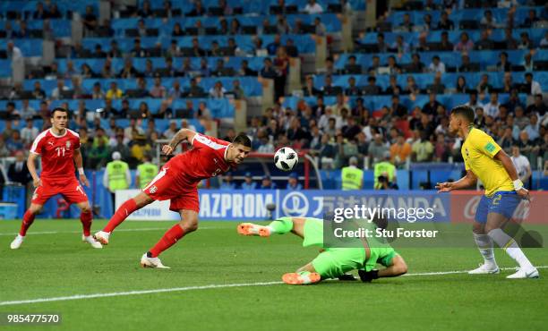 Aleksandar Mitrovic of Serbia heads against Thiago Silva of Brazil as goalkeeper Alisson looks on during the 2018 FIFA World Cup Russia group E match...