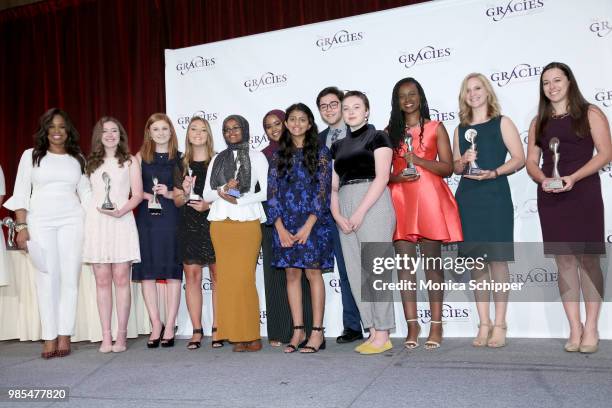 Pam Olivers poses with the recipients of the TV Student Market and Interactive Awards at The Gracies, presented by the Alliance for Women in Media...