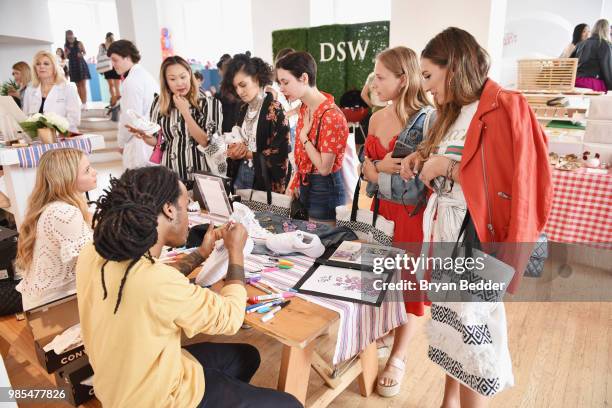 Guests attend DSW Block Party hosted by Olympians Adam Rippon and Mirai Nagasu on June 27, 2018 at Ramscale Studio in New York City.