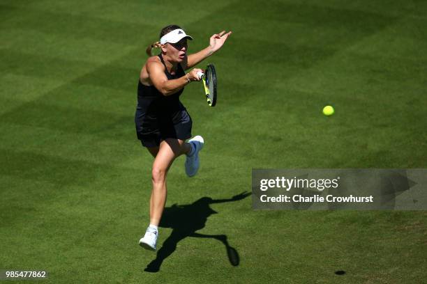 Caroline Wozniacki of Denmark in action during her women's singles match against Johanna Konta of Great Britain during Day Six of the Nature Valley...