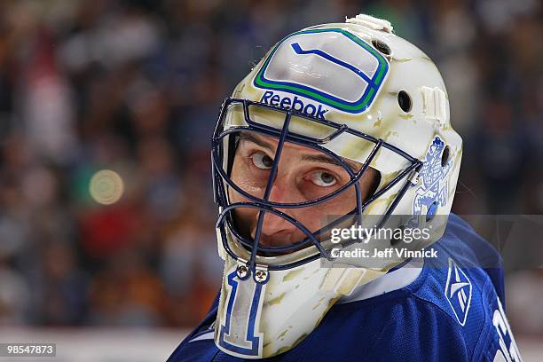 Roberto Luongo of the Vancouver Canucks looks on from his crease in Game One of the Western Conference Quarterfinals against the Los Angeles Kings...