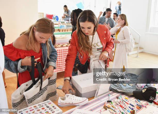 Guests enjoy the custom shoe bar during the DSW Block Party hosted by Olympians Adam Rippon and Mirai Nagasu on June 27, 2018 at Ramscale Studio in...