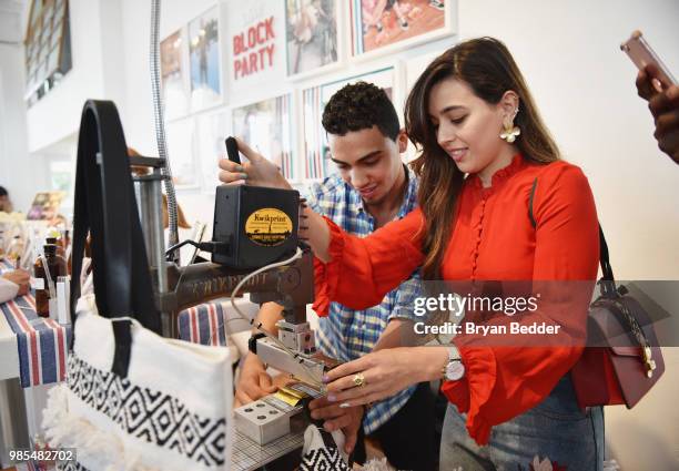 Guests enjoy the custom shoe bar during the DSW Block Party hosted by Olympians Adam Rippon and Mirai Nagasu on June 27, 2018 at Ramscale Studio in...