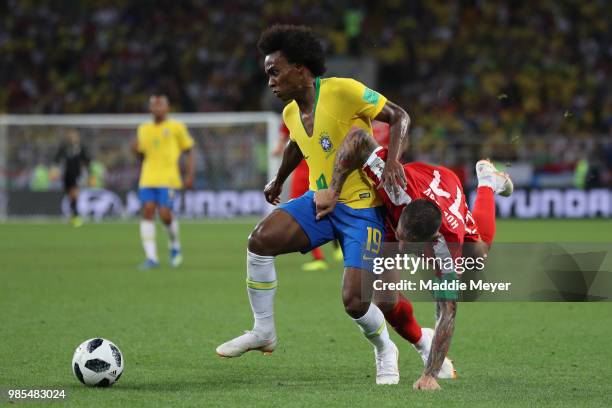 Aleksandar Kolarov of Serbia challenes Willian of Brazil during the 2018 FIFA World Cup Russia group E match between Serbia and Brazil at Spartak...