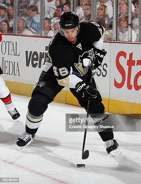 Tyler Kennedy of the Pittsburgh Penguins controls the puck against the Ottawa Senators in Game One of the Eastern Conference Quarterfinals during the...