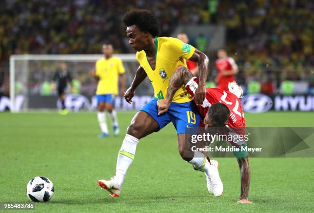 Aleksandar Kolarov of Serbia challenes Willian of Brazil during the 2018 FIFA World Cup Russia group E match between Serbia and Brazil at Spartak...