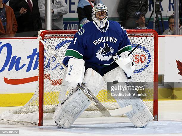 Roberto Luongo of the Vancouver Canucks watches a shot in Game One of the Western Conference Quarterfinals against the Los Angeles Kings during the...