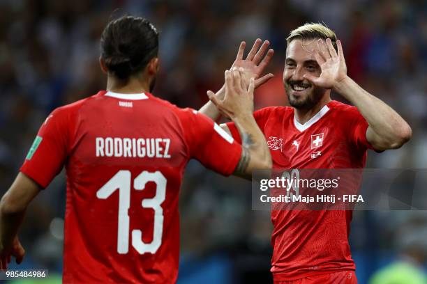 Josip Drmic of Switzerland celebrates with teammate Ricardo Rodriguez after scoring his team's second goal during the 2018 FIFA World Cup Russia...