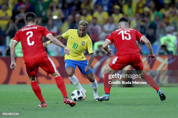 Neymar Jr of Brazil is challenged by Antonio Rukavina and Nikola Milenkovic of Serbia during the 2018 FIFA World Cup Russia group E match between...