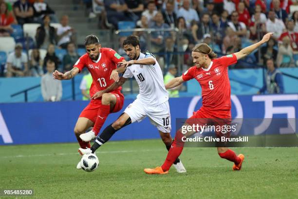 Ricardo Rodriguez and Michael Lang of Switzerland combine to tackle Bryan Ruiz of Costa Rica during the 2018 FIFA World Cup Russia group E match...