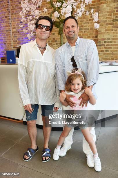 Nick Grimshaw, Gareth Skewis with daughter Aurelia attend the launch of the Palace x Adidas Wimbledon kit on June 27, 2018 in London, England.
