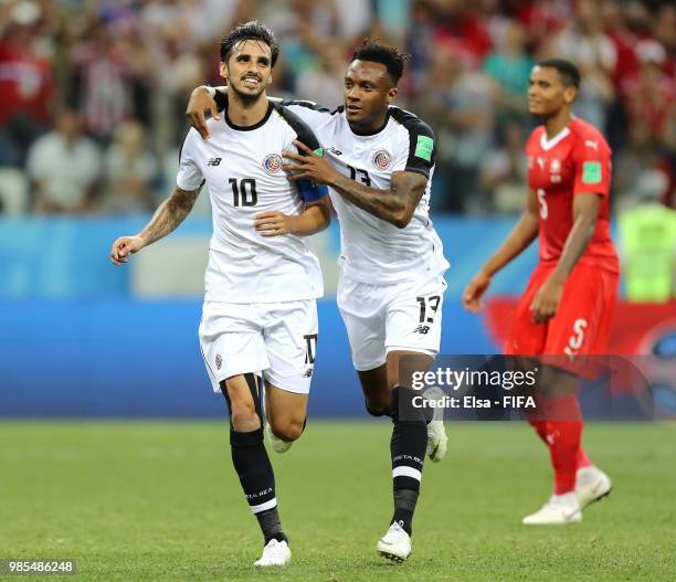 Bryan Ruiz of Costa Rica celebrates with teammate Rodney Wallace after scoring a penalty for his team's second goal during the 2018 FIFA World Cup...