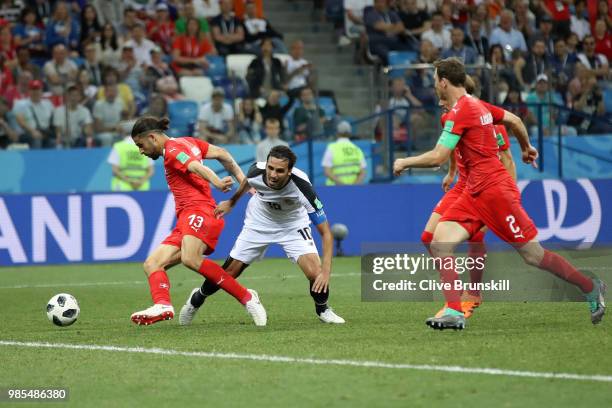 Ricardo Rodriguez and Michael Lang of Switzerland combine to tackle Bryan Ruiz of Costa Rica during the 2018 FIFA World Cup Russia group E match...