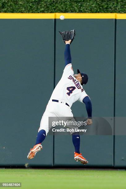 George Springer of the Houston Astros makes a running over-the-shoulder catch on line drive off the bat of Yangervis Solarte of the Toronto Blue Jays...