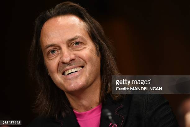 Mobile CEO John Legere arrives to testify at the Senate Judiciary Committee's Subcommittee on Antitrust, Competition Policy and Consumer Rights...