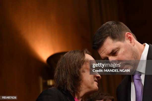 Mobile CEO John Legere and Sprint Executive Chairman Marcelo Claure speak before they testify at the Senate Judiciary Committee's Subcommittee on...