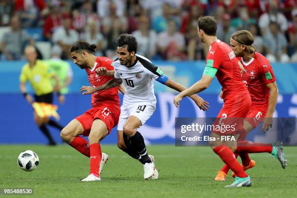 Ricardo Rodriguez of Switzerland is tackled by Bryan Ruiz of Costa Rica during the 2018 FIFA World Cup Russia group E match between Switzerland and...