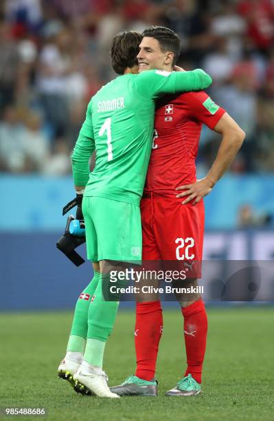 Yann Sommer of Switzerland speaks with Fabian Schaer of Switzerland after the 2018 FIFA World Cup Russia group E match between Switzerland and Costa...
