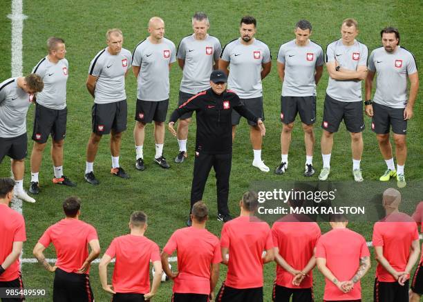 Poland's coach Polish Adam Nawalka speaks with players during a training session at the Volgograd arena in Volgograd on June 27, 2018 on the eve of...