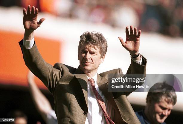 Manager Arsene Wenger of Arsenal celebrates as Arsenal qualify for next years champions league during the match between Arsenal and Leeds United in...