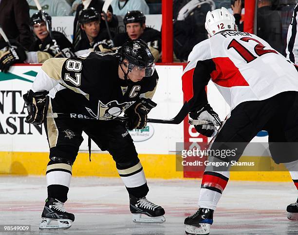 Sidney Crosby of the Pittsburgh Penguins lines up for a faceoff against Mike Fisher of the Otttawa Senators in Game One of the Eastern Conference...