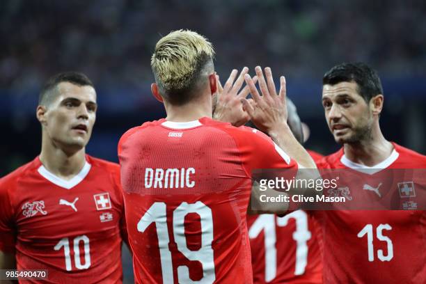 Josip Drmic of Switzerland celebrates with teammate Blerim Dzemaili after scoring his team's second goal during the 2018 FIFA World Cup Russia group...