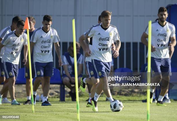 Argentina's midfielder Lucas Biglia drives a ball during a training session at the team's base camp in Bronnitsy, near Moscow, Russia on June 27,...