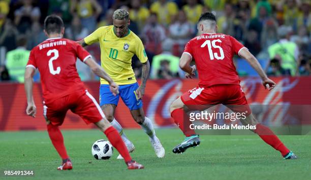 Neymar Jr of Brazil is challenged by Antonio Rukavina and Nikola Milenkovic of Serbia during the 2018 FIFA World Cup Russia group E match between...