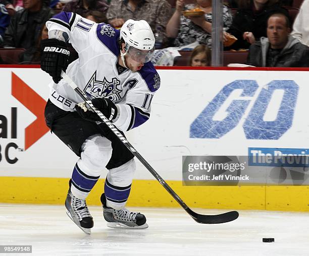 Anze Kopitar of the Los Angeles Kings skates up ice with the puck in Game Two of the Western Conference Quarterfinals against the Vancouver Canucks...