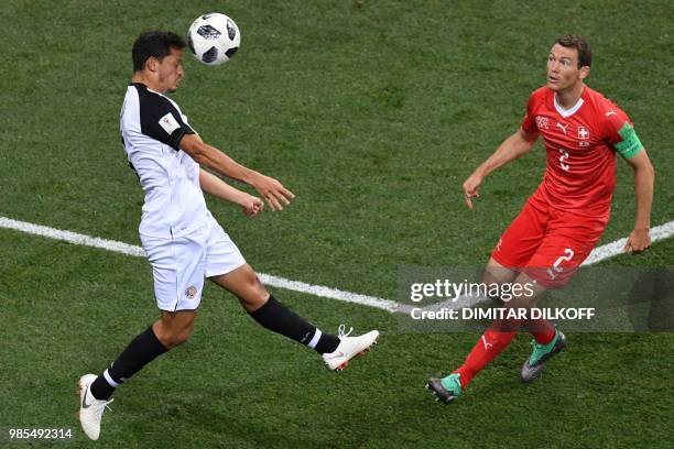 Costa Rica's midfielder Celso Borges vies for the ball with Switzerland's defender Stephan Lichtsteiner during the Russia 2018 World Cup Group E...