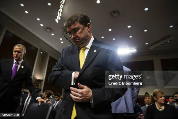 Robert Wilkie, secretary of Veterans Affairs nominee for U.S. President Donald Trump, center, arrives for a confirmation hearing before the Senate...