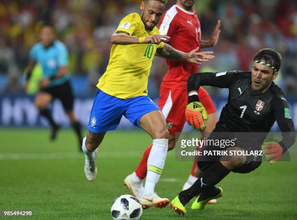 Brazil's forward Neymar vies with Serbia's goalkeeper Vladimir Stojkovic during the Russia 2018 World Cup Group E football match between Serbia and...