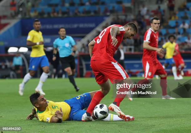 Casemiro of Brazil vies with Aleksandar Mitrovic of Serbia during the 2018 FIFA World Cup Russia group E match between Serbia and Brazil at Spartak...