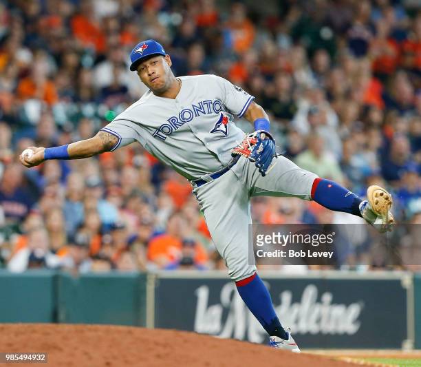 Yangervis Solarte of the Toronto Blue Jays throws after fielding a slow rolling ground ball off the bat of Jose Altuve of the Houston Astros in the...
