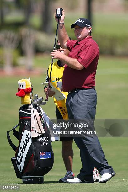 Jarrod Lyle pulls a club from his bag while alongside his caddie during the final round of the Chitimacha Louisiana Open at Le Triomphe Country Club...