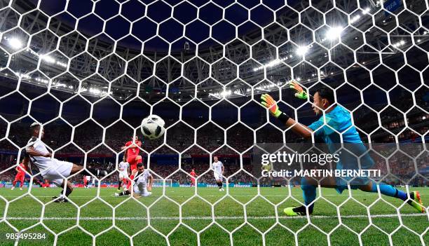 Switzerland's midfielder Blerim Dzemaili shoots and scores the opening goal past Costa Rica's goalkeeper Keylor Navas during the Russia 2018 World...