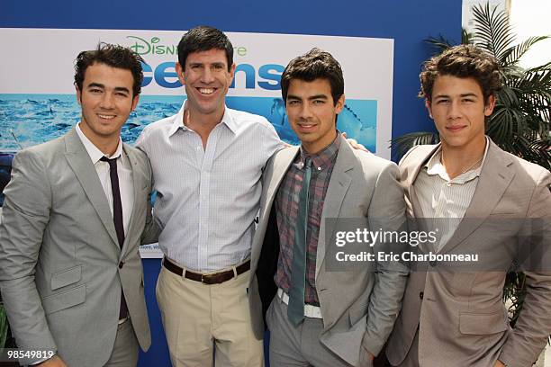 Kevin Jonas, Disney's Rich Ross, Joe Jonas and Nick Jonas at Disneynature's premiere of 'Oceans' on April 17, 2010 at the El Capitan Theatre in...