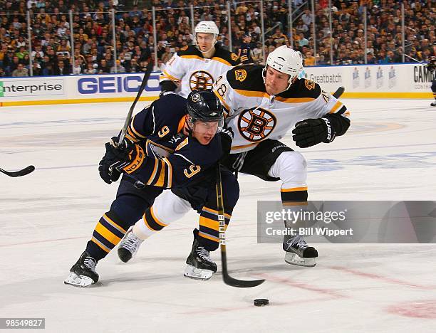 Derek Roy of the Buffalo Sabres skates with the puck against Matt Hunwick of the Boston Bruins in Game Two of the Eastern Conference Quarterfinals...