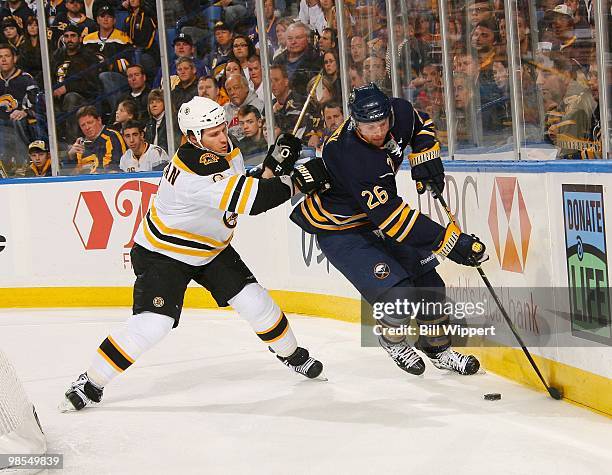 Thomas Vanek of the Buffalo Sabres controls the puck against Dennis Wideman of the Boston Bruins in Game Two of the Eastern Conference Quarterfinals...