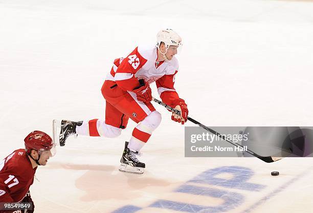 Darren Helm of the Detroit Red Wings skates the puck up ice against the Phoenix Coyotes in Game Two of the Western Conference Quarterfinals during...