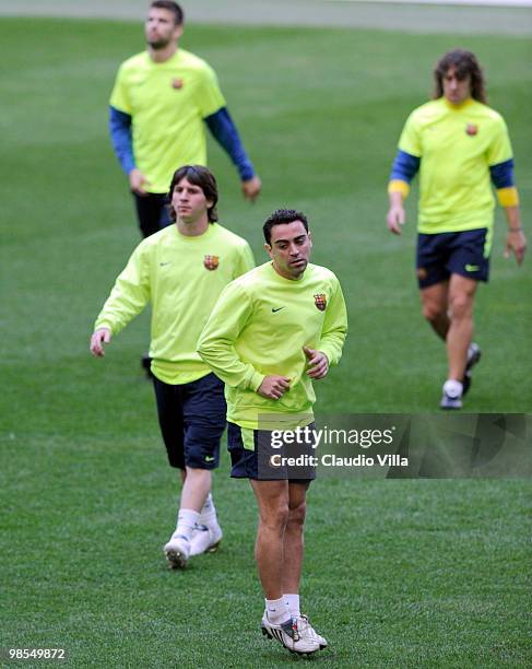 Xavier Hernandez Creus and Lionel Messi of FC Barcelona during the Training Session at Giuseppe Meazza Stadium on April 19, 2010 in Milan, Italy.