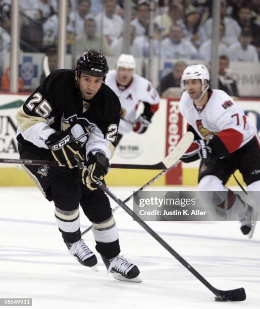 Maxime Talbot of the Pittsburgh Penguins handles the puck against the Ottawa Senators in Game Two of the Eastern Conference Quarterfinals during the...