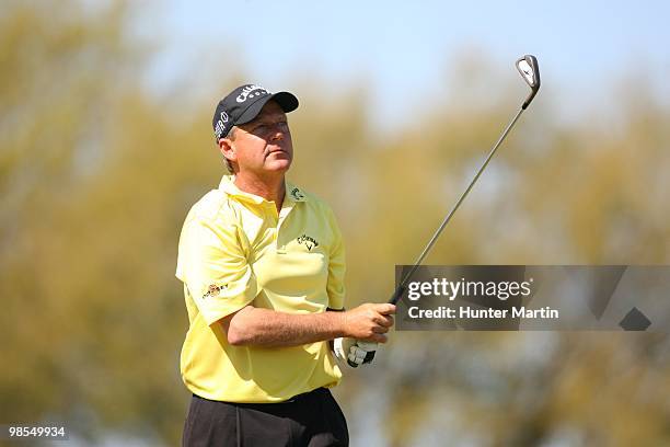 Mark Brooks watches his shot during the first round of the Chitimacha Louisiana Open at Le Triomphe Country Club on March 25, 2010 in Broussard,...