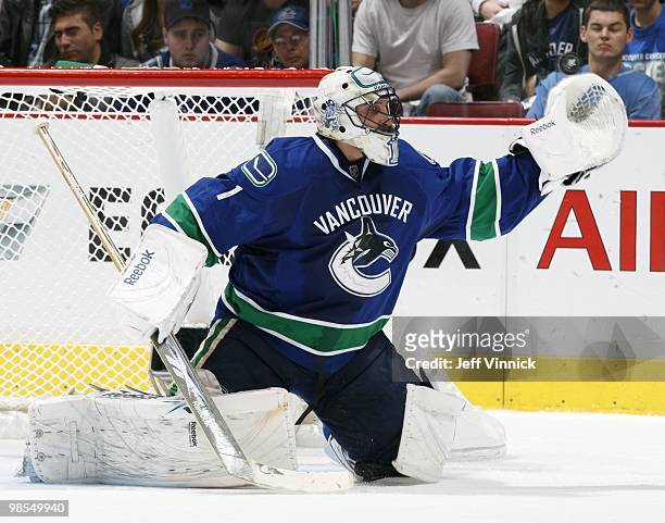 Roberto Luongo of the Vancouver Canucks makes a glove save in Game Two of the Western Conference Quarterfinals against the Los Angeles Kings during...