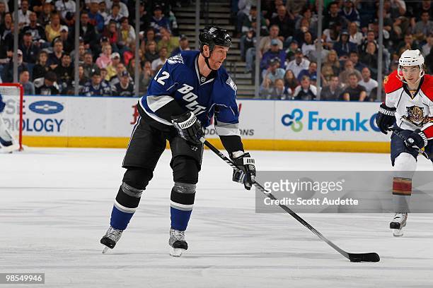 Ryan Malone of the Tampa Bay Lightning passes the puck against the Florida Panthers at the St. Pete Times Forum on April 10, 2010 in Tampa, Florida.